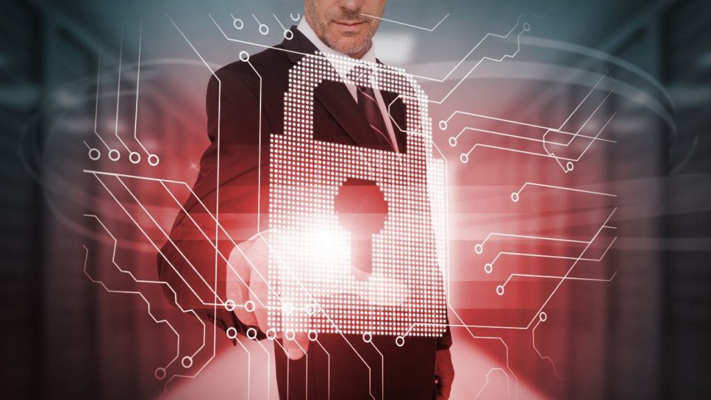 Executivo interagindo com um cadeado digital, representando proteção de dados, cibersegurança corporativa e preparação das empresas contra ameaças impulsionadas por IA.